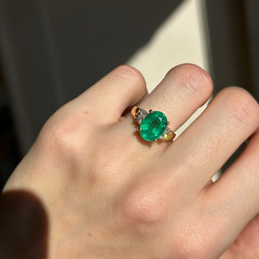 14KT Yellow Gold Oval 3.48 CT Emerald + Round Diamond Ring