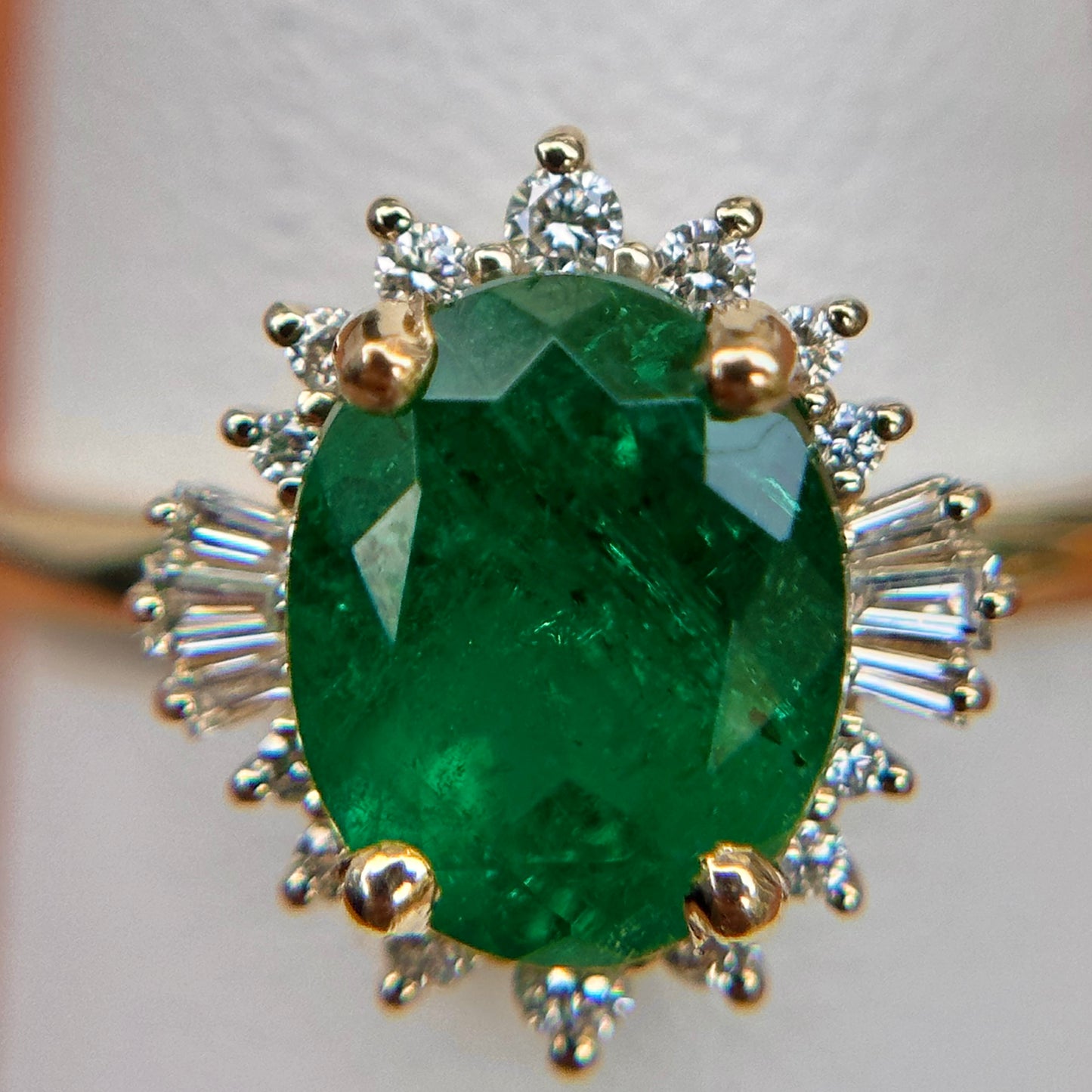 14KT Yellow Gold Oval Colombian Emerald + Baguette Halo Ring