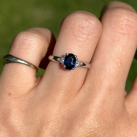 10KT White Gold Oval .97 CT Blue Sapphire + Trillion Diamond Ring