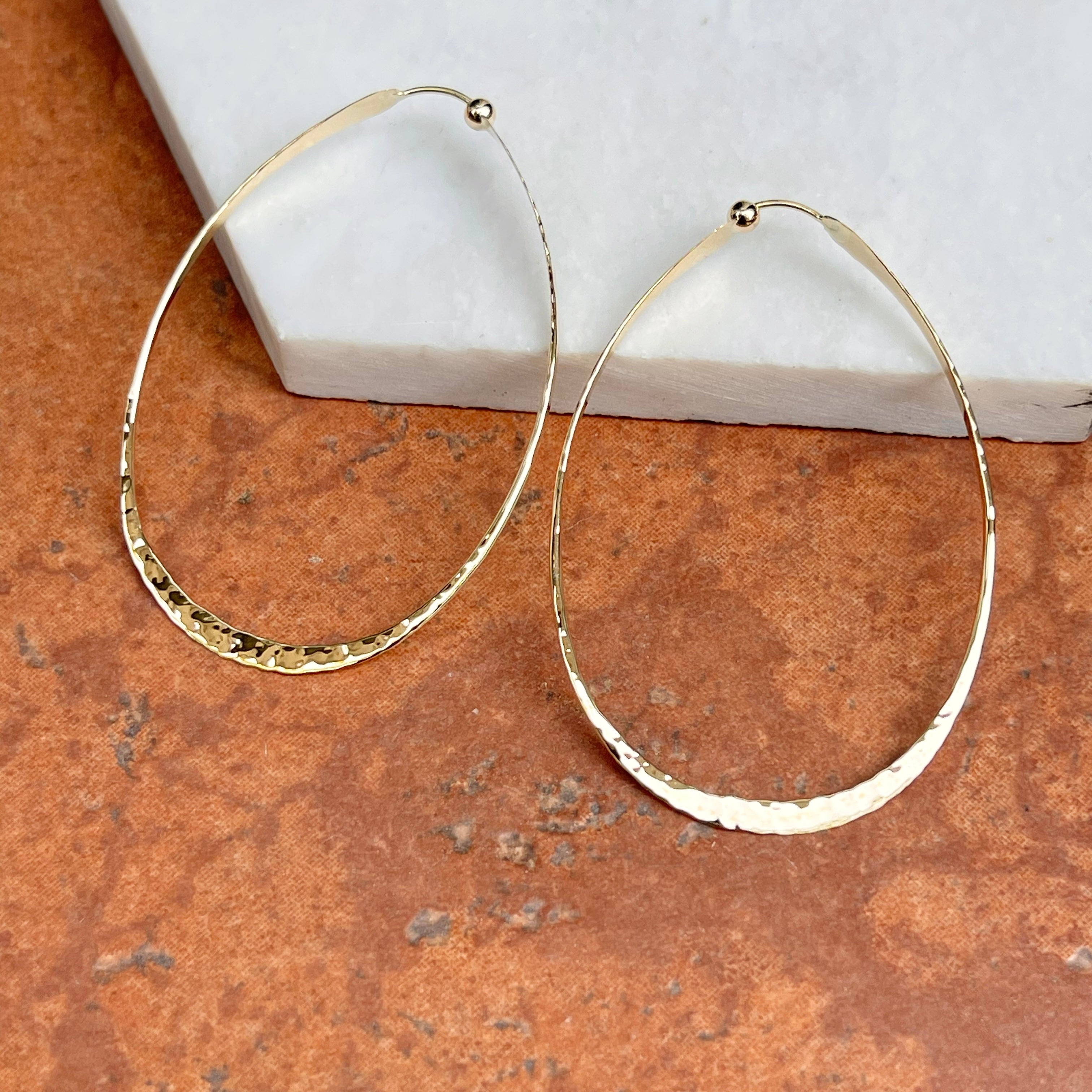 Hammered gold store hoop earrings 14k