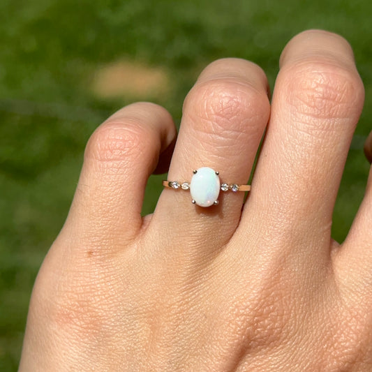 10KT Yellow Gold Oval White Opal and Round Diamond Ring