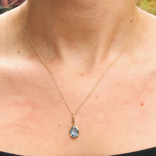 14KT Yellow Gold Oval Blue Topaz Omega Pendant, 14KT Yellow Gold Oval Blue Topaz Omega Pendant - Legacy Saint Jewelry