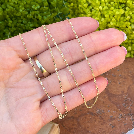 10KT Yellow Gold 1.35mm Singapore Chain Necklace 24"