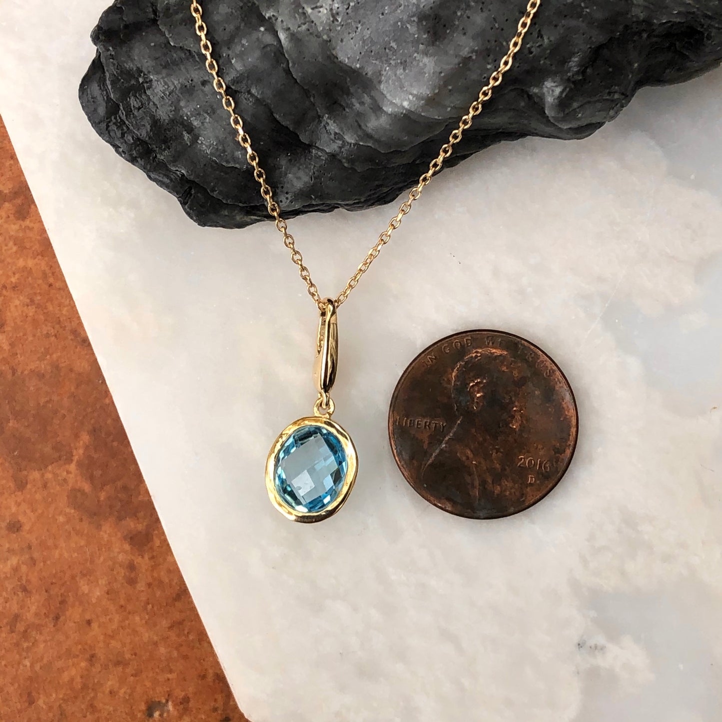 14KT Yellow Gold Oval Blue Topaz Omega Pendant, 14KT Yellow Gold Oval Blue Topaz Omega Pendant - Legacy Saint Jewelry