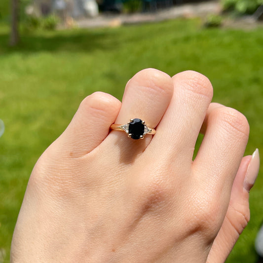 14KT Yellow Gold Oval .95 CT Blue Sapphire + Trillion Diamond Accent Ring