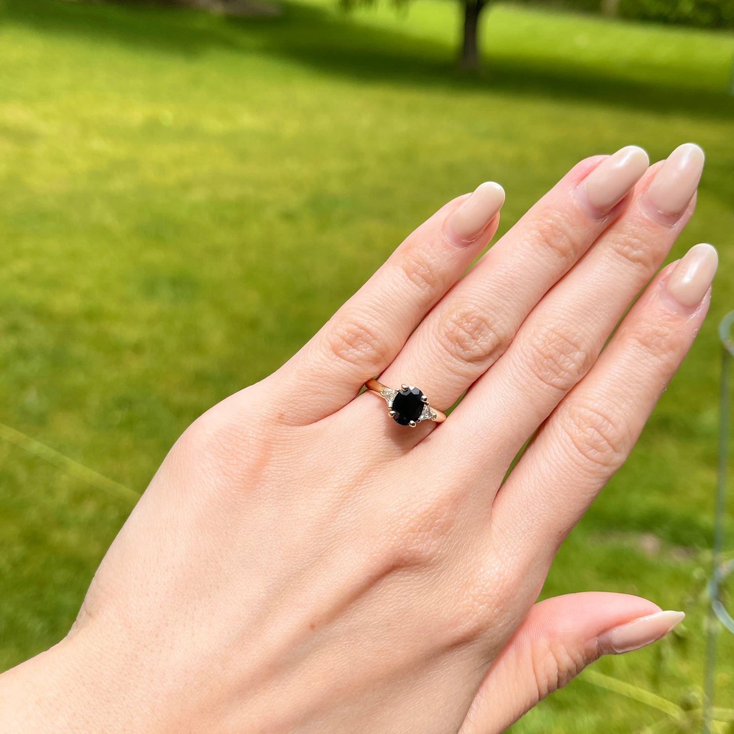 14KT Yellow Gold Oval .95 CT Blue Sapphire + Trillion Diamond Accent Ring