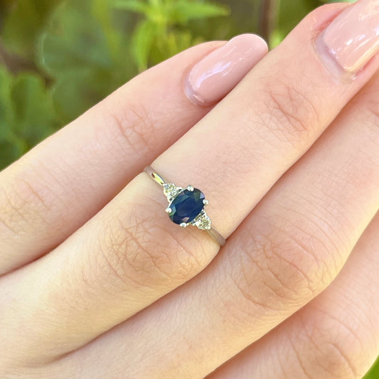Platinum Oval .75 CT Blue Sapphire + Round Diamond Accent Ring