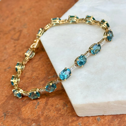 Estate 14KT Yellow Gold Round Diamond + Oval Blue Topaz Link Tennis Bracelet
