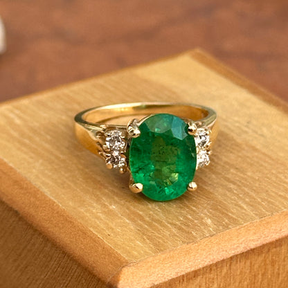 14KT Yellow Gold Oval 3.48 CT Emerald + Round Diamond Ring