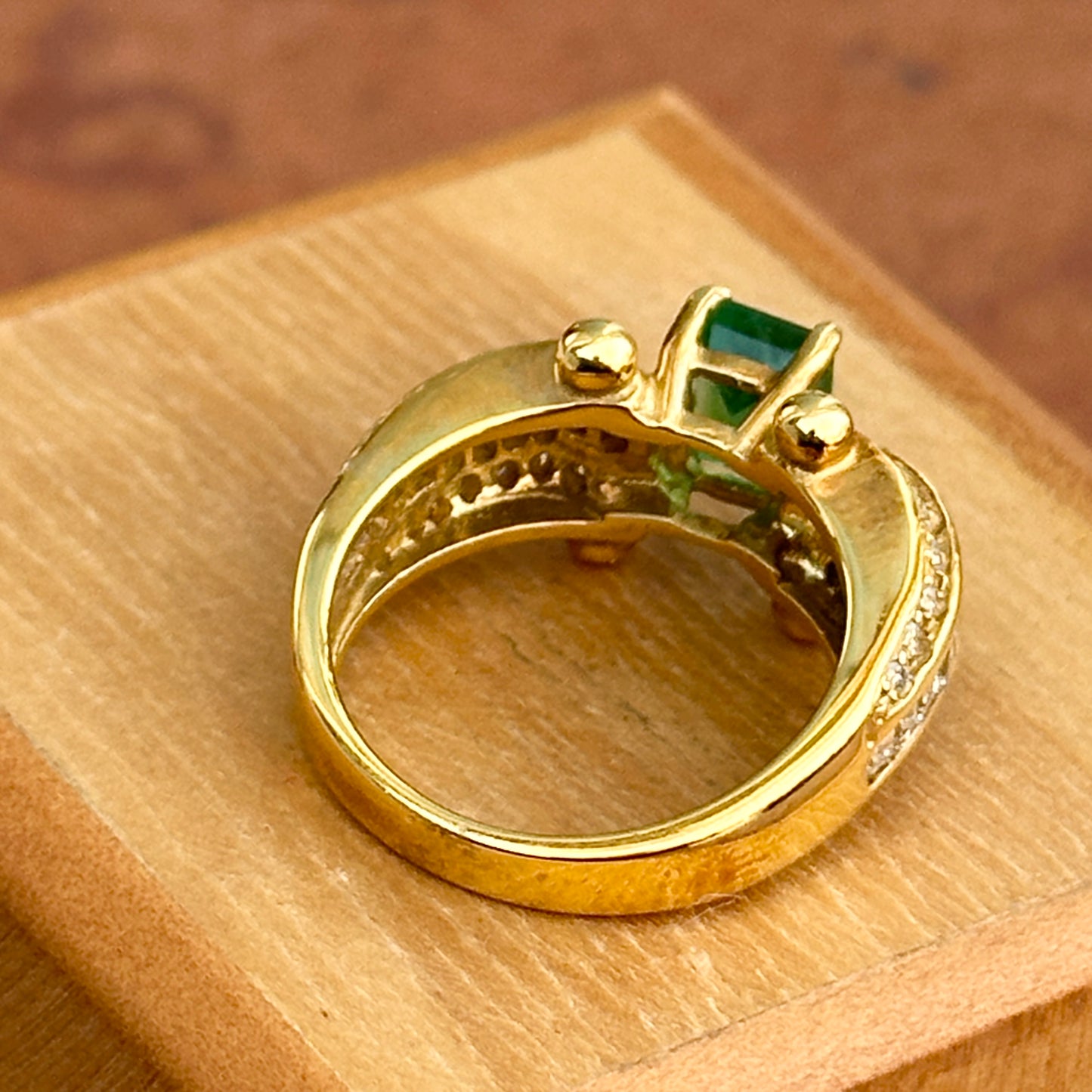 18KT Yellow Gold Emerald Cut Green Emerald + Round and Baguette Diamond Ring