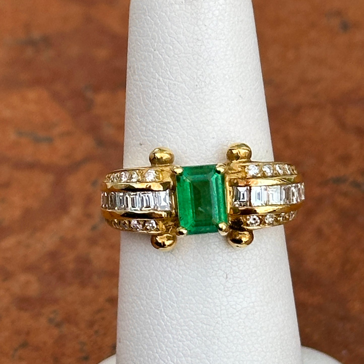 18KT Yellow Gold Emerald Cut Green Emerald + Round and Baguette Diamond Ring
