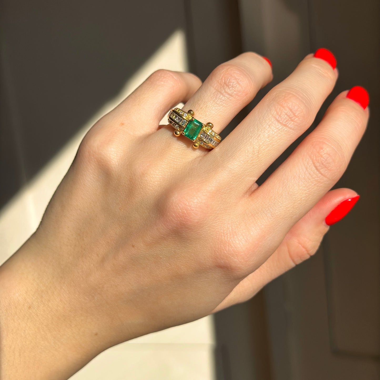 18KT Yellow Gold Emerald Cut Green Emerald + Round and Baguette Diamond Ring