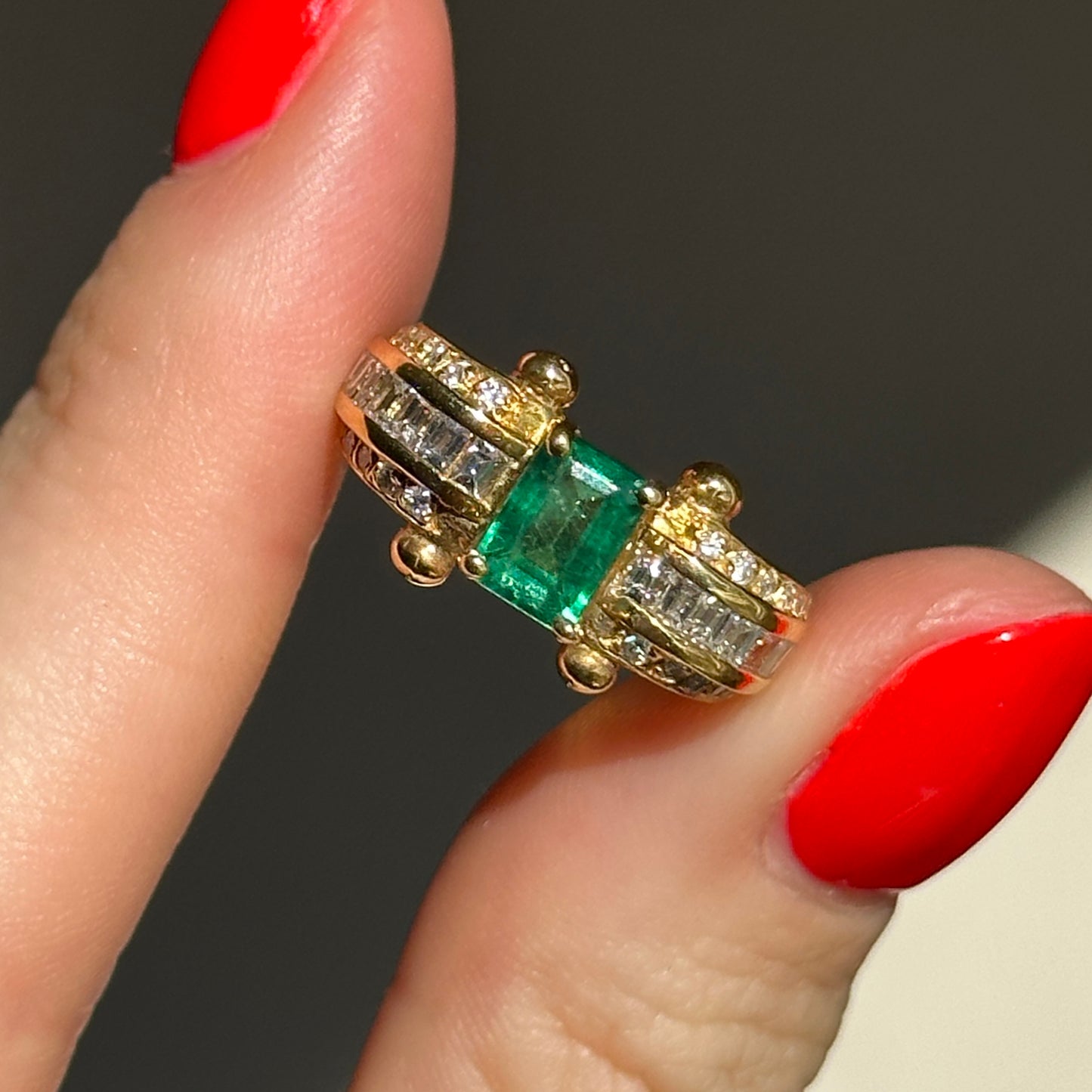 18KT Yellow Gold Emerald Cut Green Emerald + Round and Baguette Diamond Ring