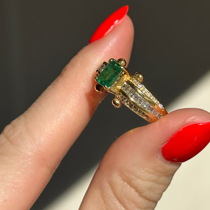 18KT Yellow Gold Emerald Cut Green Emerald + Round and Baguette Diamond Ring