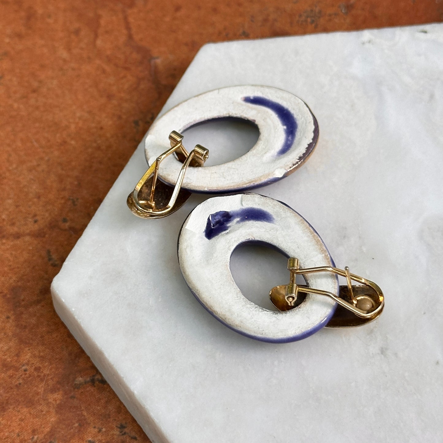 Yellow Gold Tone Pierced Omega Earrings + Oval Blue and Gold Enameled Charms