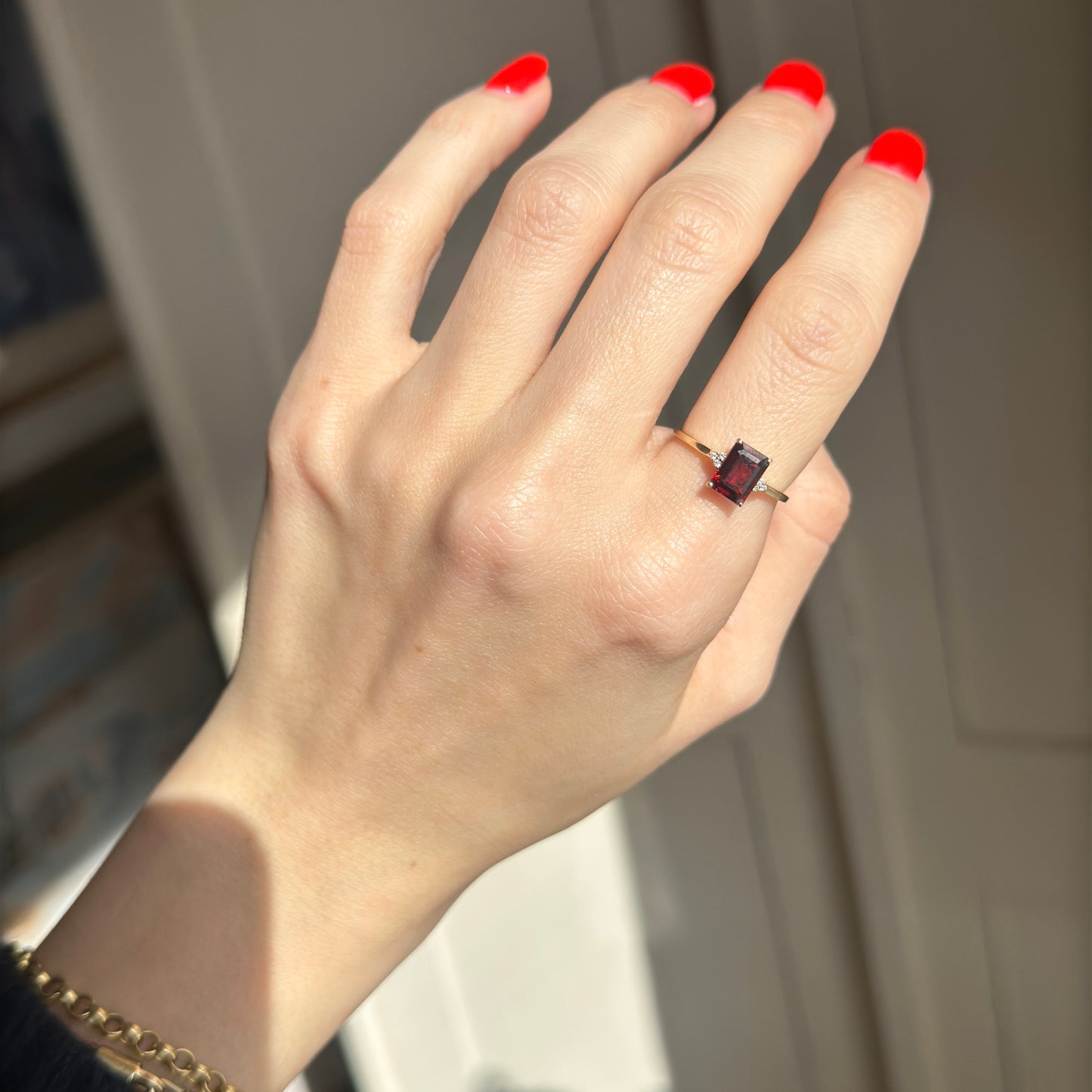 14KT Yellow Gold Emerald Cut Garnet Round Full Cut Diamonds Ring