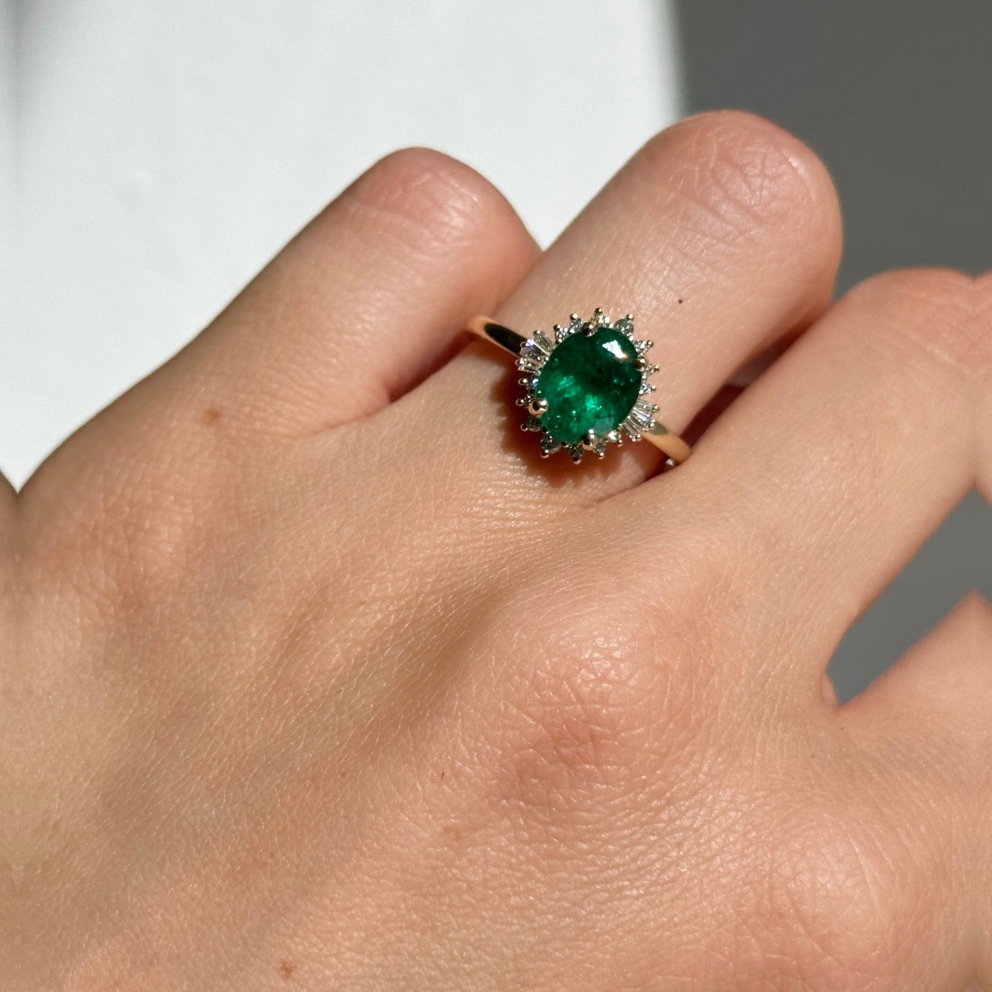 14KT Yellow Gold Oval Colombian Emerald + Baguette Halo Ring