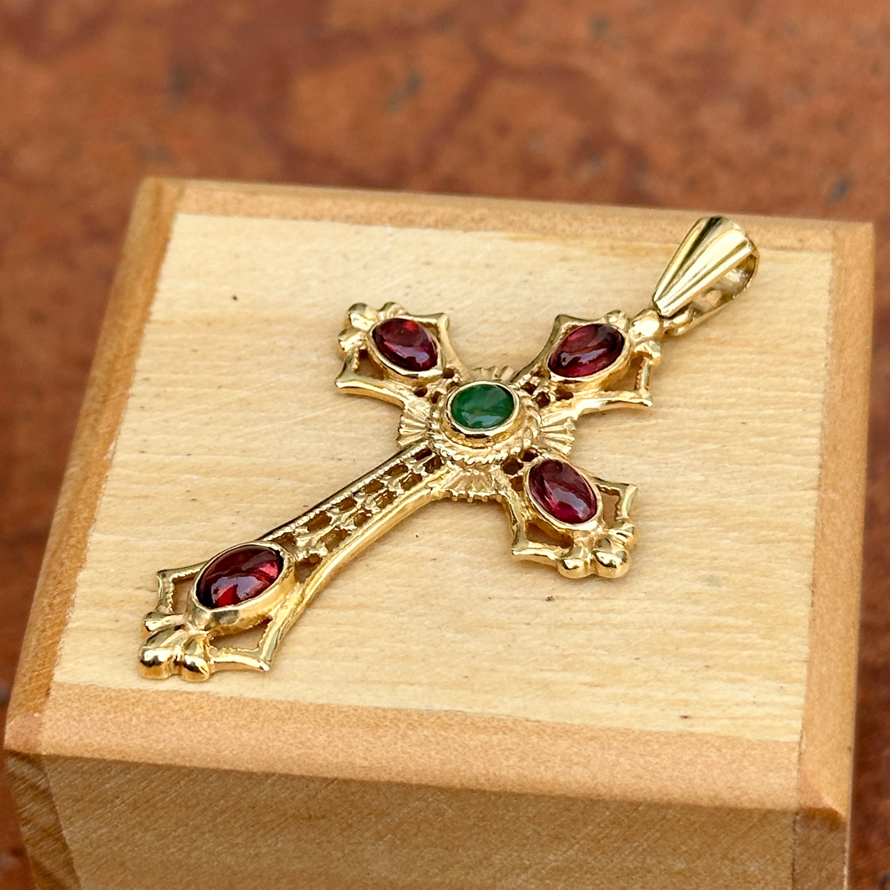 Absolutely beautiful bejeweled gold cross with Ruby in the hot middle