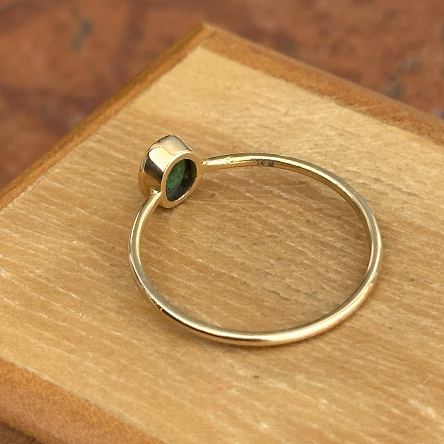 14KT Yellow Gold Bezel Oval Emerald Ring