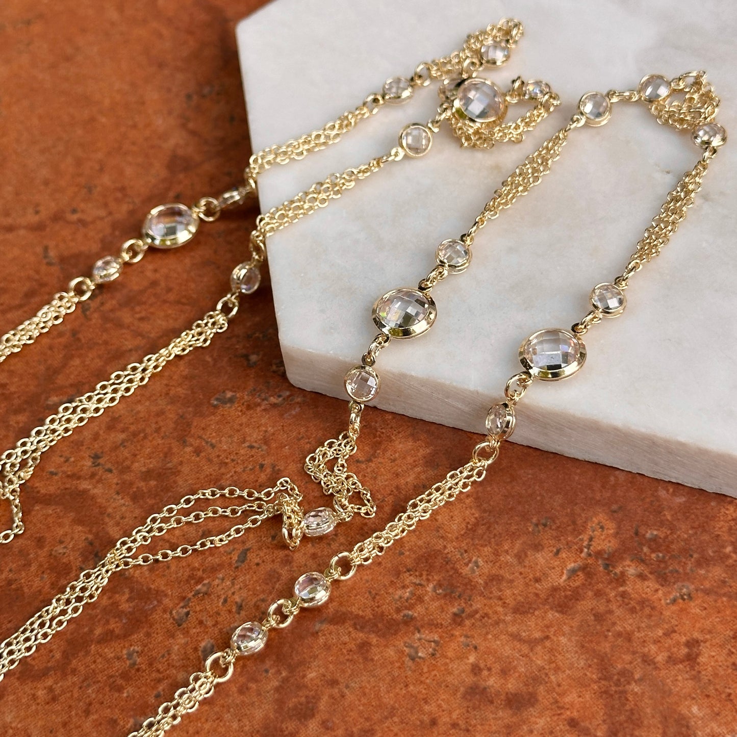 Yellow Gold-Plated Round Checkerboard Cubic Zirconia Three-Strand Necklace