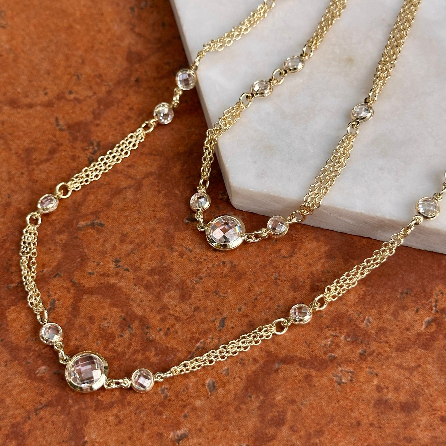 Yellow Gold-Plated Round Checkerboard Cubic Zirconia Three-Strand Necklace