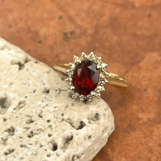 Estate 14KT Yellow Gold Oval Garnet + Diamond Halo Ring