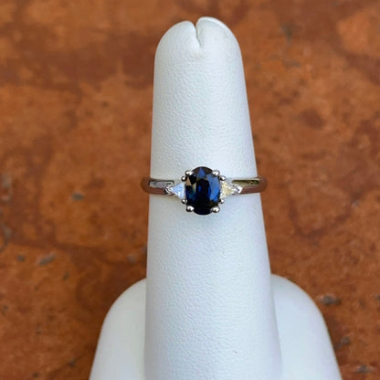 10KT White Gold Oval .97 CT Blue Sapphire + Trillion Diamond Ring
