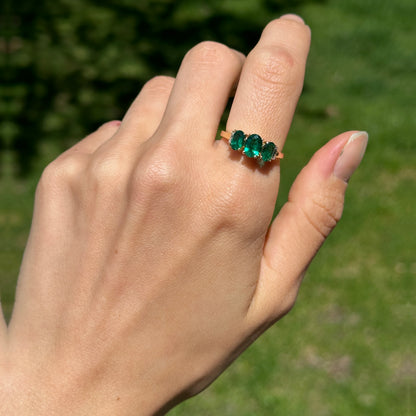 Estate 14KT Yellow Gold Three Stone Oval Lab Emerald + Diamond Ring