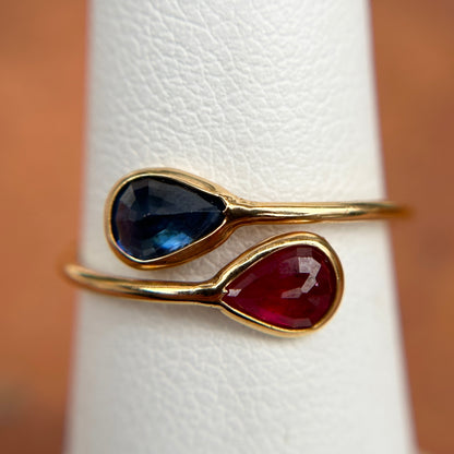 18KT Yellow Gold Pear Ruby + Blue Sapphire Bypass Ring