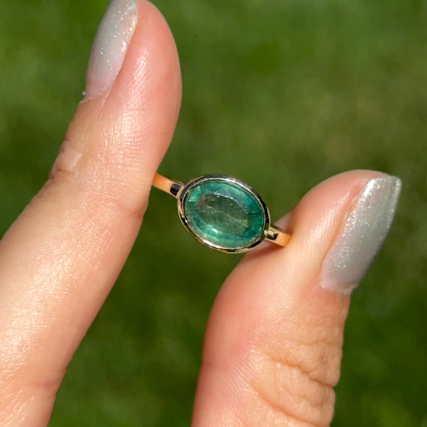14KT Yellow Gold Oval 2.15 CT Emerald East-West Ring