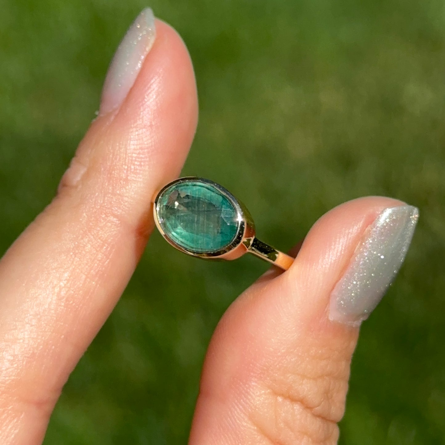 14KT Yellow Gold Oval 2.15 CT Emerald East-West Ring