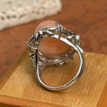Estate Platinum Peruvian Peach Opal + Diamond Halo Ring