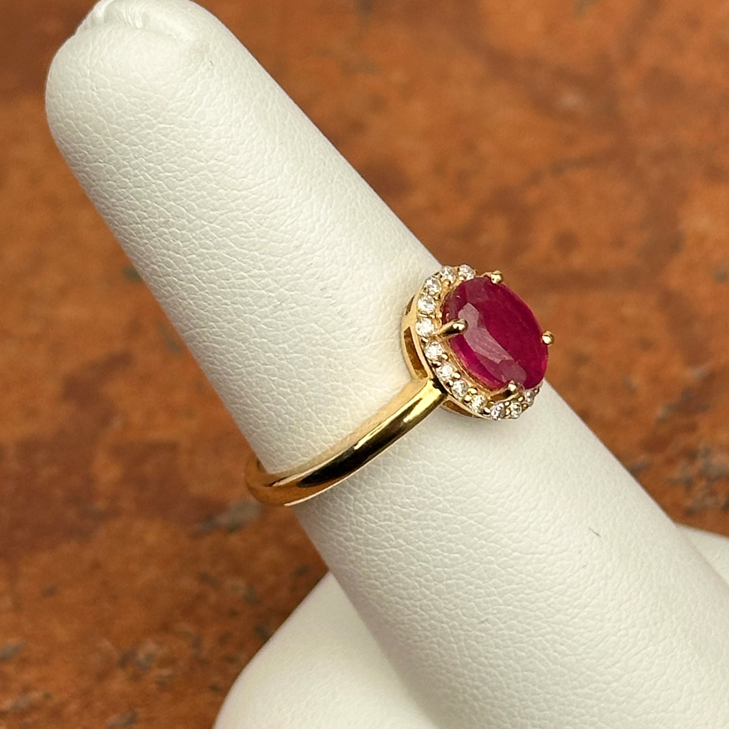 14KT Yellow Gold Oval 2 CT Ruby + Diamond Halo Ring