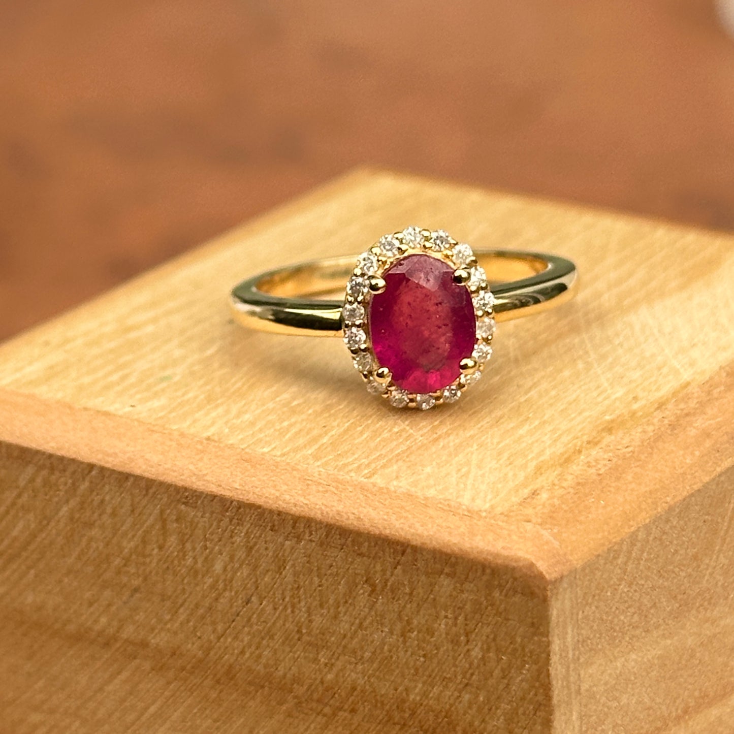 14KT Yellow Gold Oval 2 CT Ruby + Diamond Halo Ring