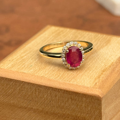 14KT Yellow Gold Oval 2 CT Ruby + Diamond Halo Ring