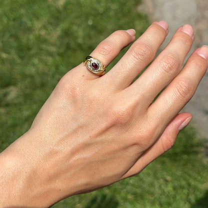 Estate 18KT Yellow Gold Oval Cabochon Ruby + Bead Set Diamonds Ring