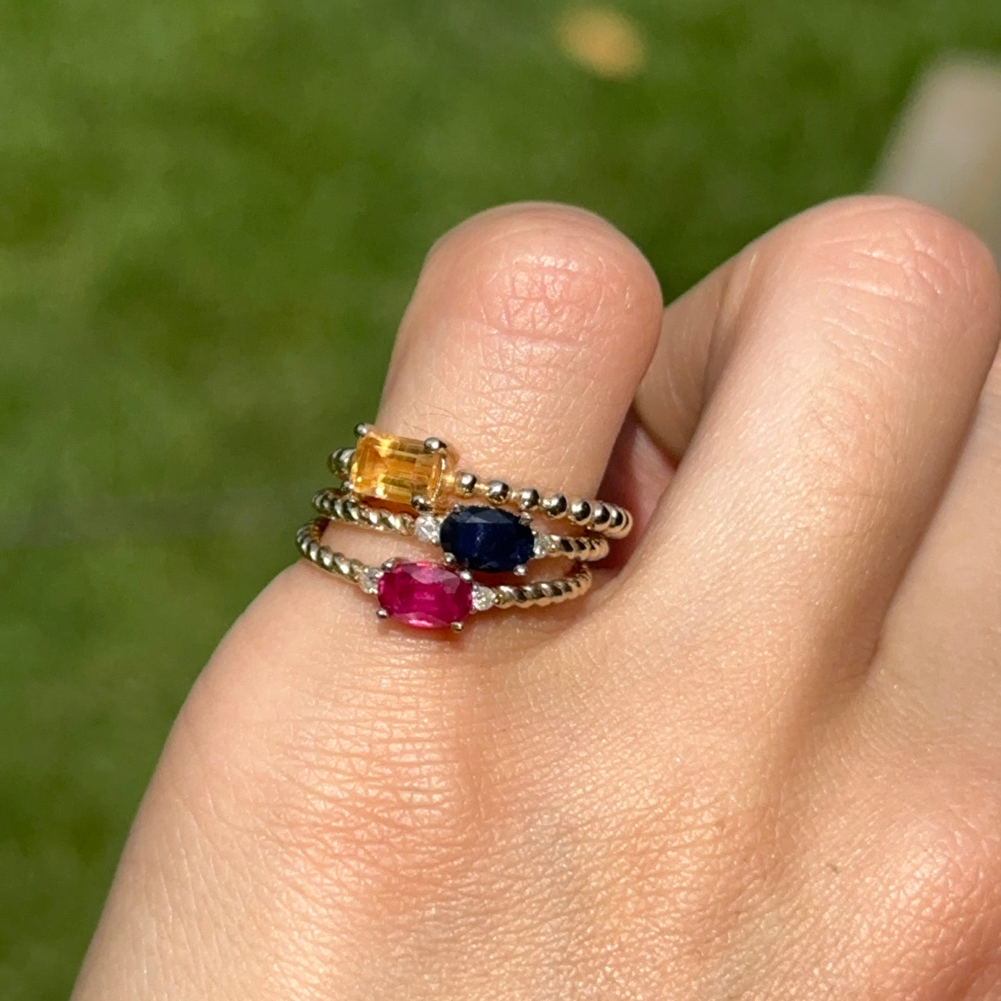 10KT Yellow Gold Oval Ruby + Round Diamond Twisted Design Ring