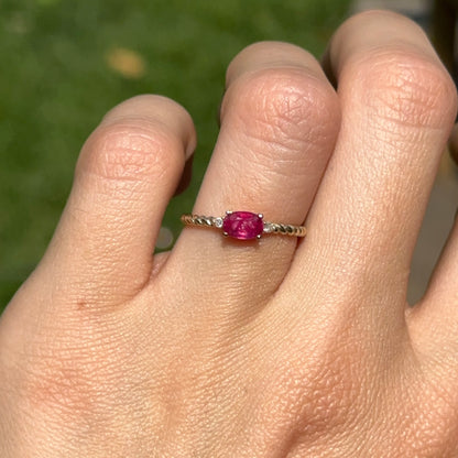 10KT Yellow Gold Oval Ruby + Round Diamond Twisted Design Ring