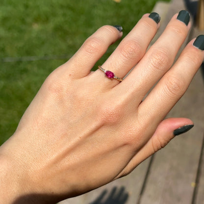 10KT Yellow Gold Oval Ruby + Round Diamond Twisted Design Ring