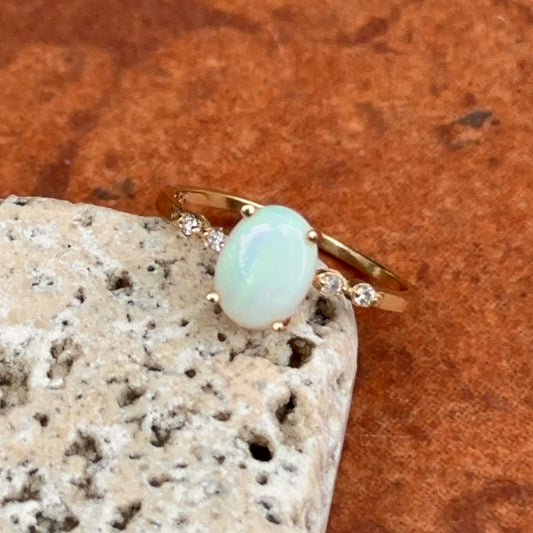 10KT Yellow Gold Oval White Opal and Round Diamond Ring