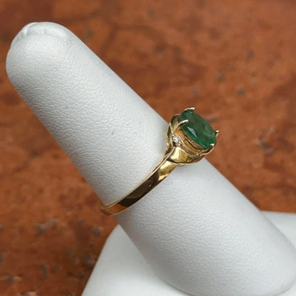 10KT Yellow Gold Oval Emerald + Round Diamond Abstract Ring