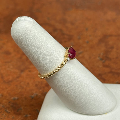 10KT Yellow Gold Oval Ruby + Round Diamond Twisted Design Ring