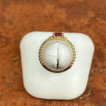 10KT Yellow Gold Oval Ruby + Round Diamond Twisted Design Ring