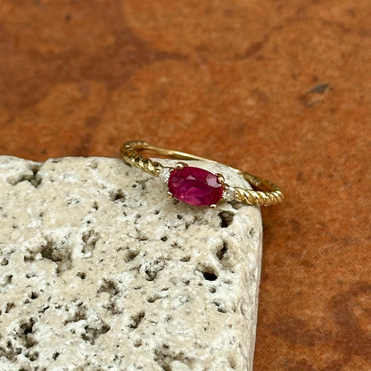 10KT Yellow Gold Oval Ruby + Round Diamond Twisted Design Ring