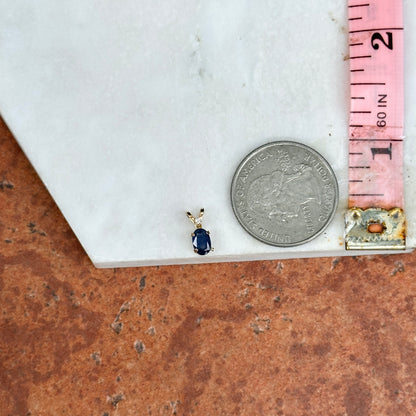 14KT Yellow Gold Oval Sapphire + Round Diamond Pendant