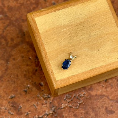 14KT Yellow Gold Oval Sapphire + Round Diamond Pendant
