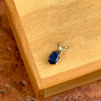 14KT Yellow Gold Oval Sapphire + Round Diamond Pendant
