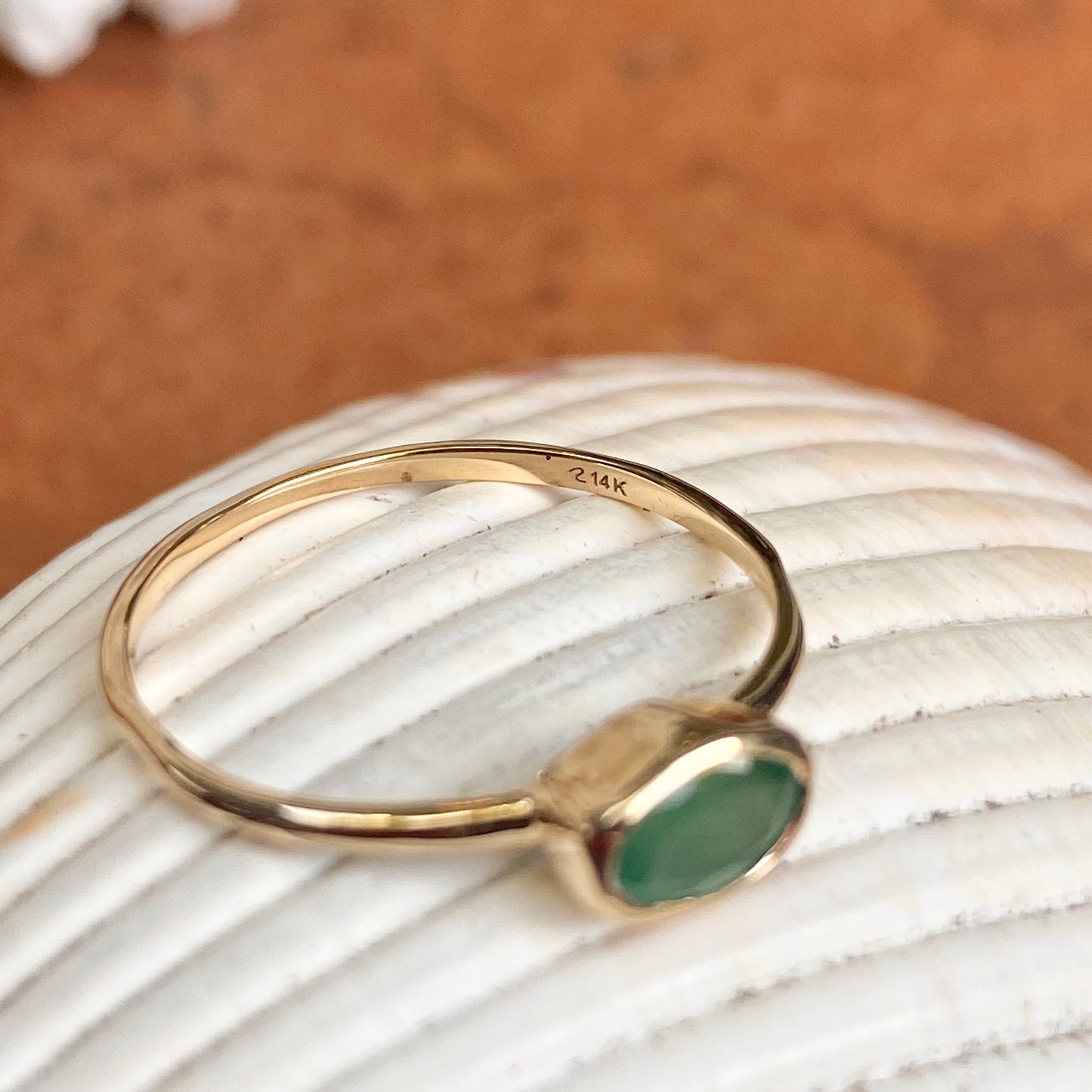14KT Yellow Gold Oval Bezel Set .55 CT Emerald Ring