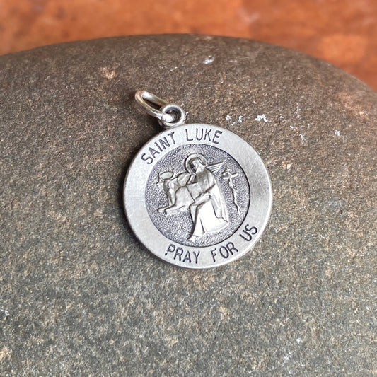 Sterling Silver Antiqued Saint Luke Small Round Medal Pendant Charm, Sterling Silver Antiqued Saint Luke Small Round Medal Pendant Charm - Legacy Saint Jewelry