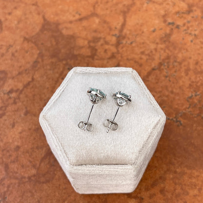 Sterling Silver Round Aquamarine + Diamond Halo Stud Earrings